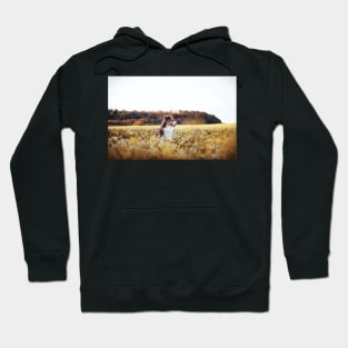 Dog in flower field Hoodie